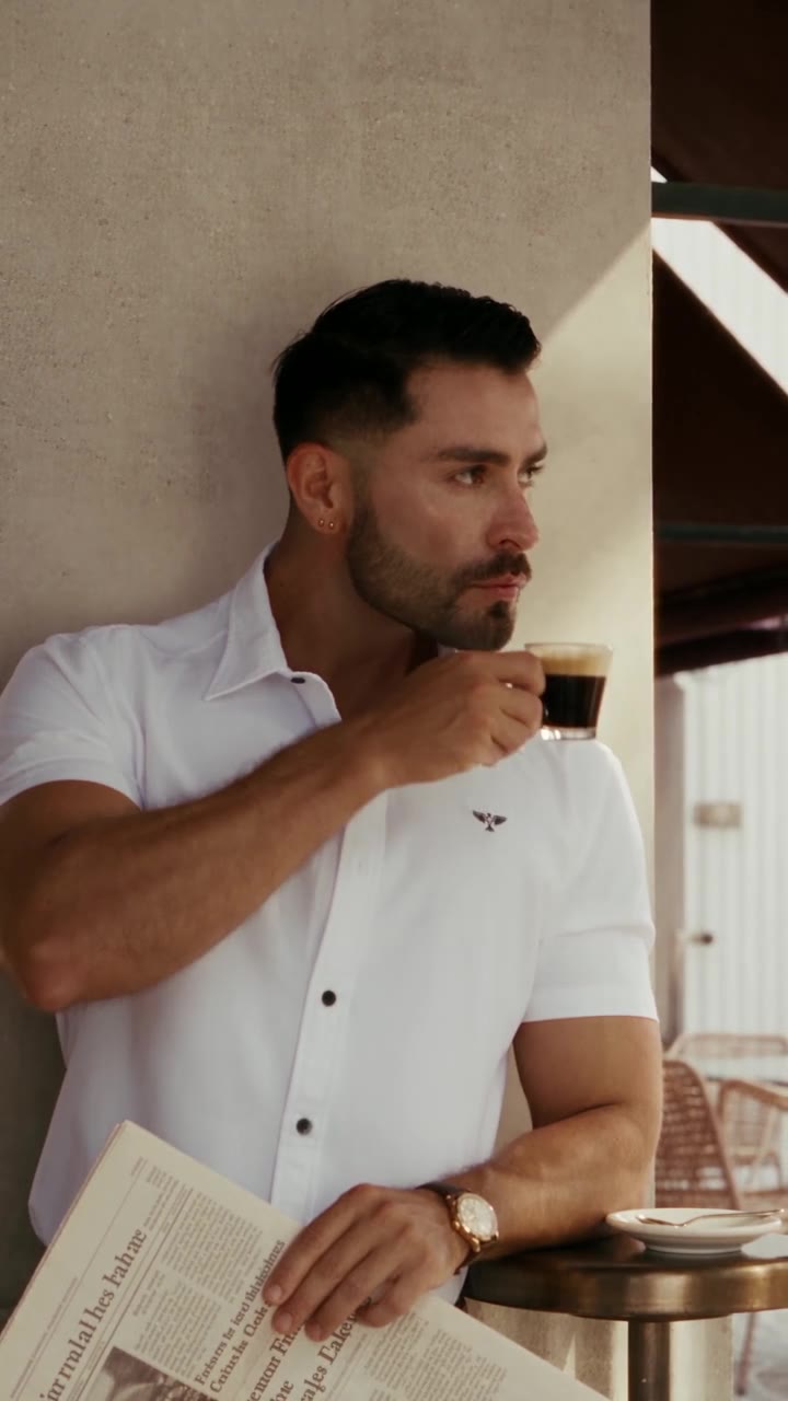 Guillo fitted white shirt styled with chinos at a villa