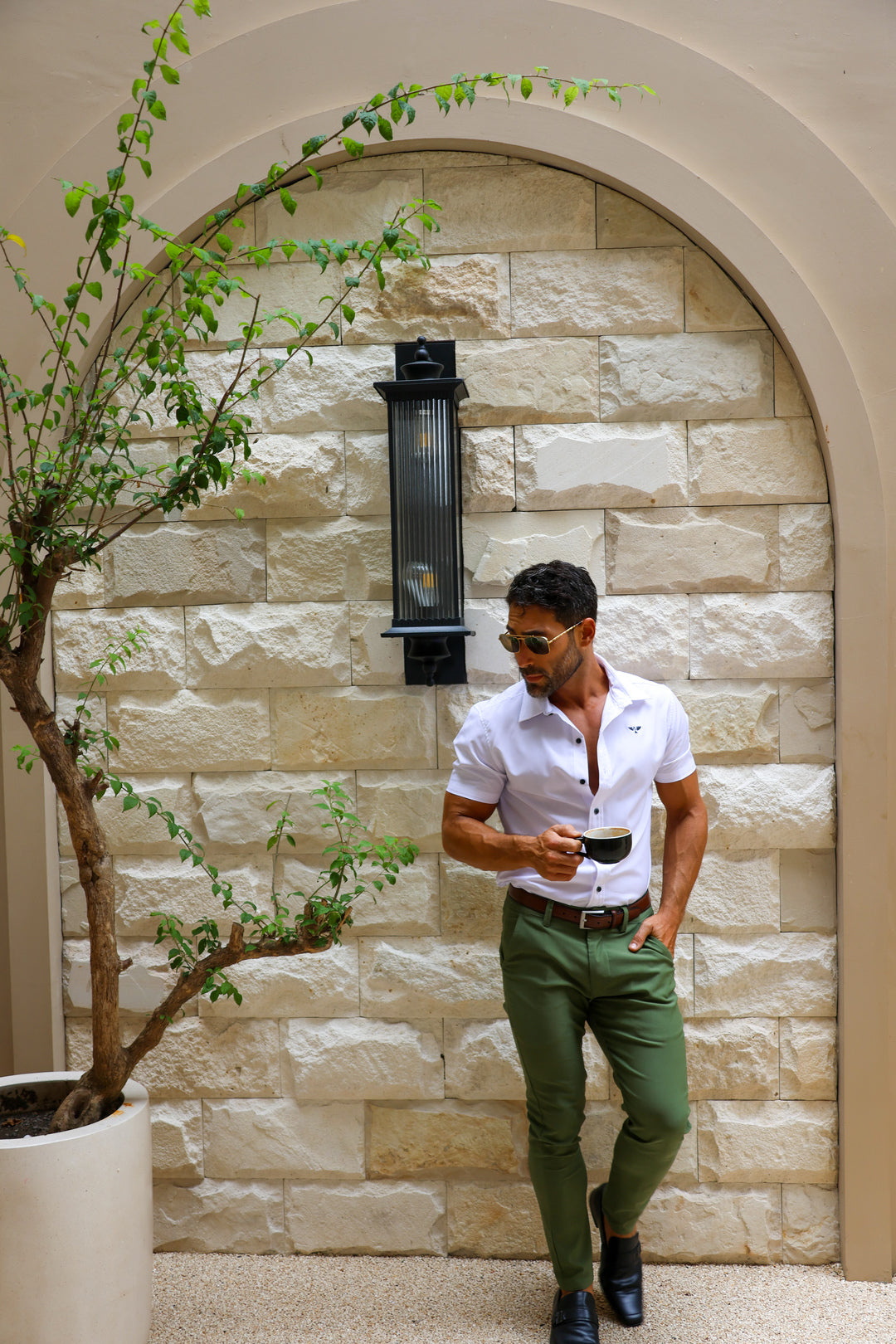 A fitted white shirt with brown chinos