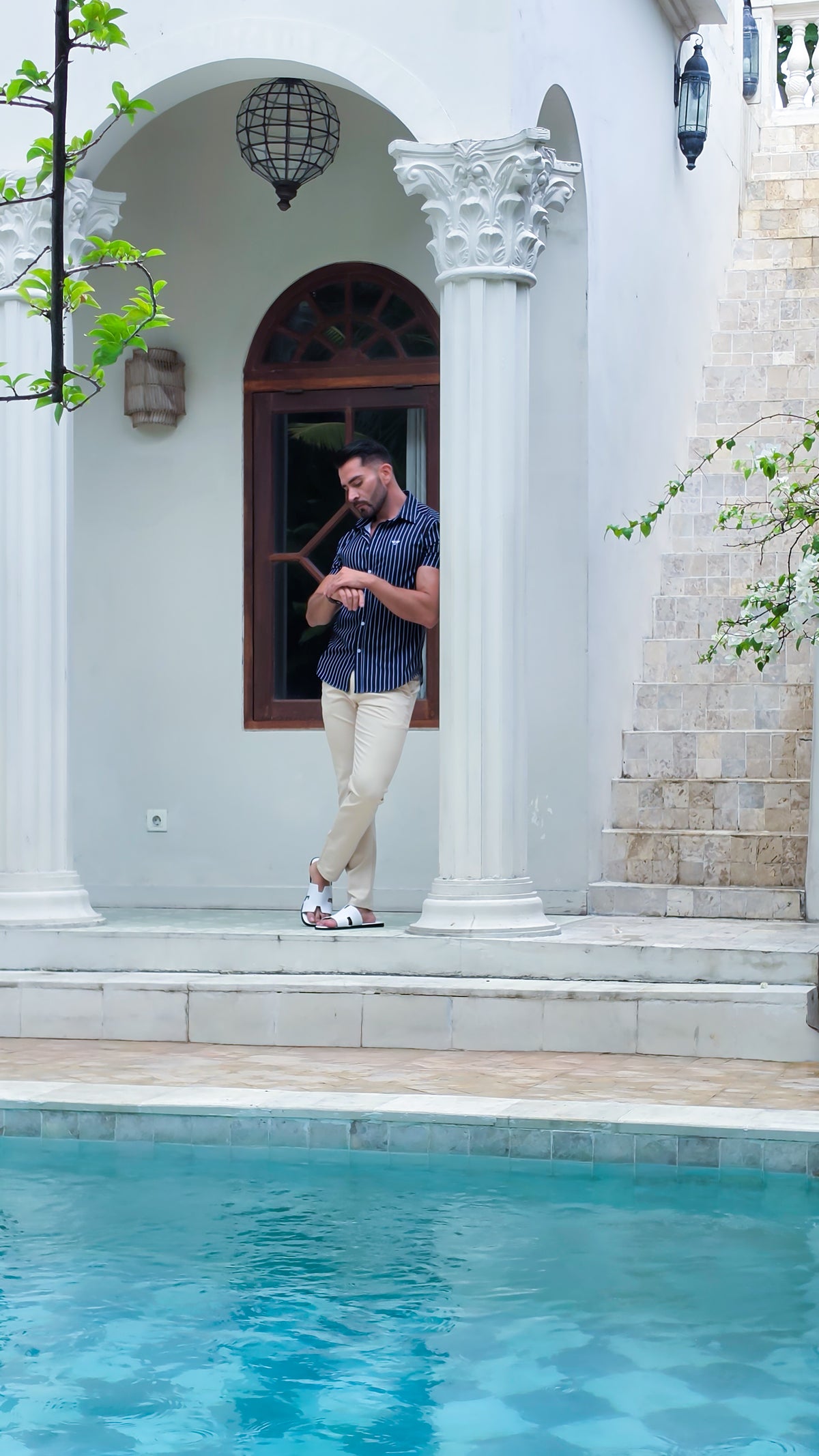 Guillo blue shirt and brown trousers styled with a navy jacket