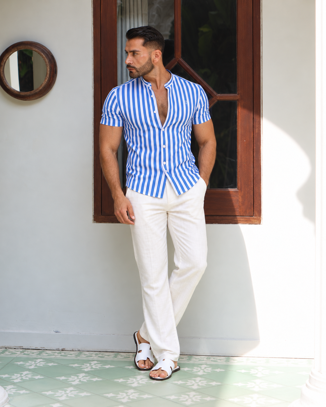 The Alassio Linen Pants in white with a striped shirt